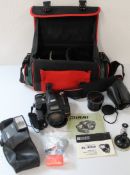 Camera bag containing Richo Mirri camera with manuals, Teleconvertor TC -200M in soft case, camera
