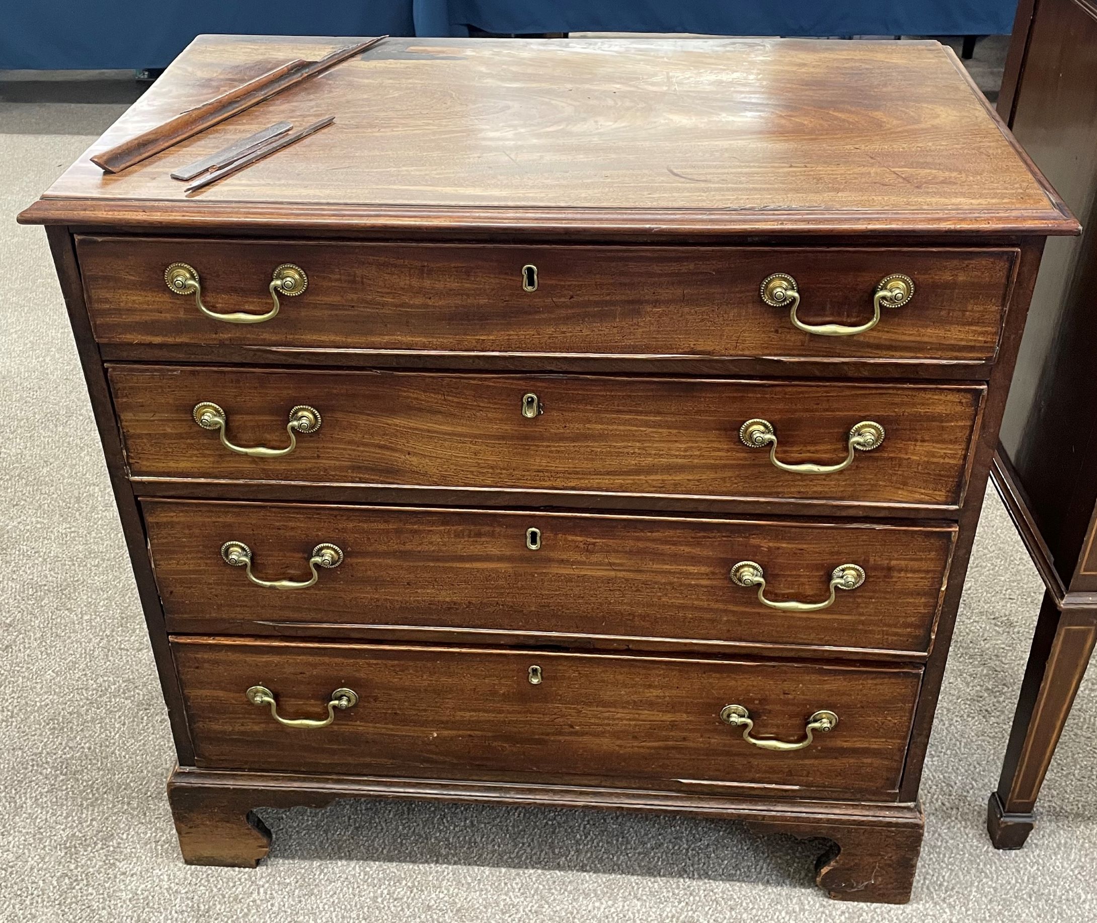 Georgian mahogany chest of drawers with brass swan neck handles on bracket feet (molding missing /