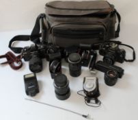 A Collection of Praktika cameras and attachments, to include a Praktika BMS electronic camera with