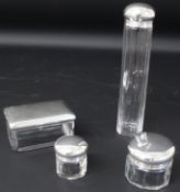 Set of four dressing table pots with silver plated lids, largest 18cm