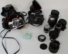 2 x Miranda Sensorex cameras, Chinon CP 9AF camera, Yashica Electron 35, 5 lenses