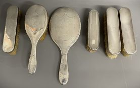 Three piece silver backed dressing table set & three silver back dressing table brushes