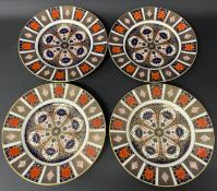 Four Royal Crown Derby Imari pattern 1128 dinner plates W 27cm