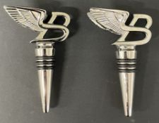 Two Bentley silver plate wine stoppers