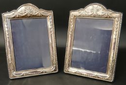 Pair of silver easel photograph frames with embossed swag decoration, maker Carrs Sheffield 2009,
