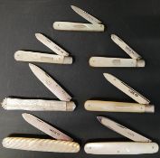 Six mother of pearl folding fruit knives with silver blades and one with stainless steel blade