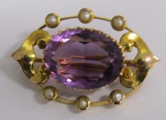 Amethyst and seed pearl brooch set in tested as 15ct gold - total weight 3.1g