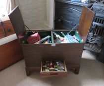 A 1930s stained oak sewing chest with green baise interior, 2ft (61cm) wide.