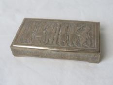 A Persian white metal cigarette box chased and engraved with a depiction of Nebuchadnezzar and a