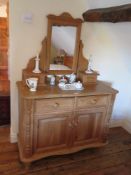 A contemporary pine dressing chest comprising mirror, jewellery drawers, drawers and doors under,