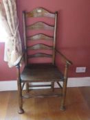 A single Lancashire ladderback solid seat chair in oak.