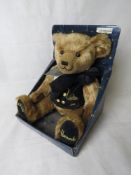 A Harrods Millennium 2000 teddy in original packaging.