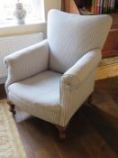 A fine upholstered oversprung scroll armchair.