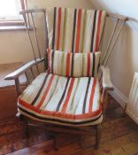 A stylised spindle turned elbow chair in ash.