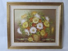 Oil on canvas, sill life of flowers, signed lower right.