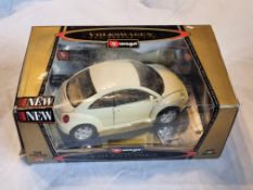 A Bburago 1:18 scale die cast model New Beetle 1998 Gold Collection