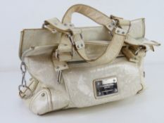A handbag by Robert Pietri in cream approx 32cm wide.
