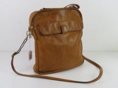 A tan leather shoulder bag by Tula, approx 27cm wide.