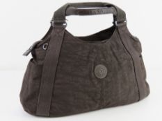 A brown canvas handbag by Kipling approx 45cm wide.