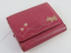 A pink leather Radley purse/wallet, approx 12cm wide.