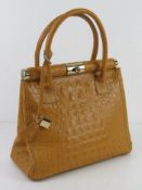 A mustard yellow Italian leather handbag, with shoulder strap, approx 28cm wide.