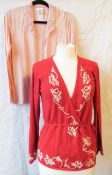 A red Laura Ashley wrap cardigan, together with another Laura Ashley Cardigan a/f bleaching noted.