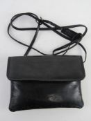 A vintage black patent leather evening shoulder bag by Taurus approx 19cm wide.