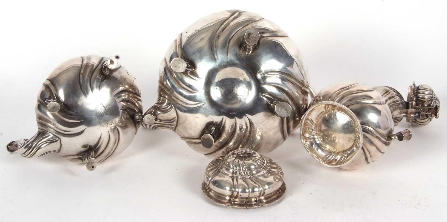 A 19th Century German white metal tea set comprising a large coffee pot, teapot, hot water kettle, - Image 7 of 9