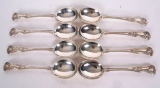Eight silver Kings pattern soup spoons, double struck, five hallmarked for London 1933, makers