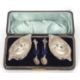 A cased late Victorian pair of boat shaped pedestal salts, floral scroll embossed together with - Image 1 of 2
