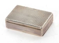 An Art Deco vester box of rectangular form, engine turned decorated lid with two vacant strike