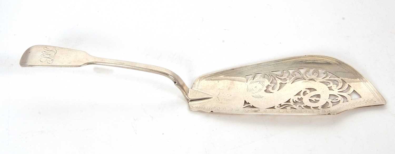 A Victorian silver fish slice, fiddle pattern having a pierced and chased blade, handle