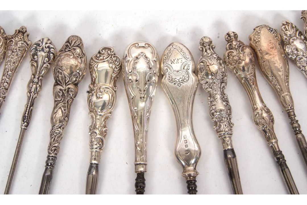A group of twenty two late 19th/early 20th Century silver and steel button hooks, various dates/ - Image 3 of 4