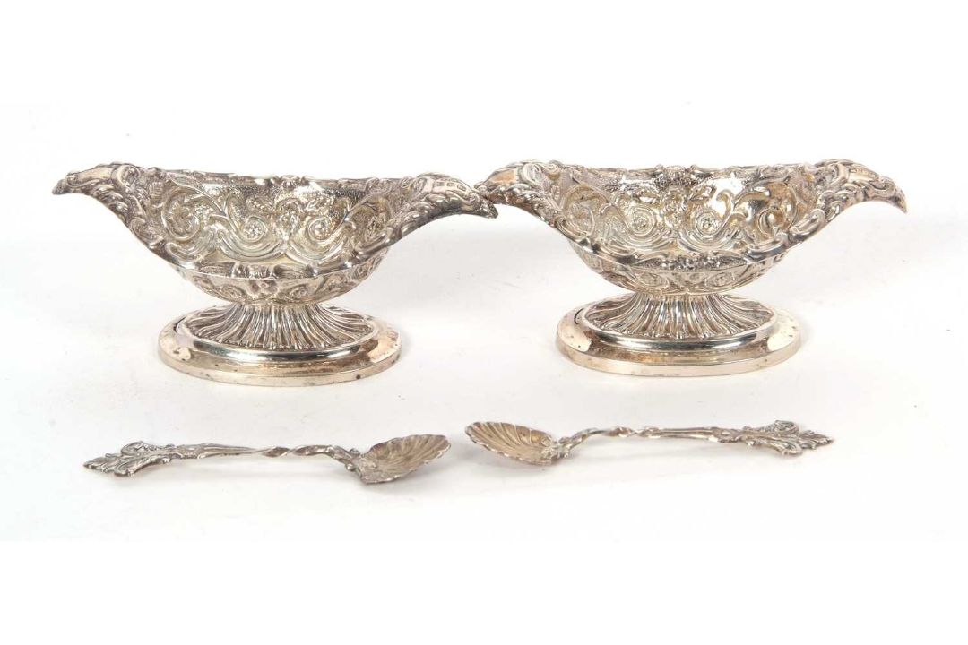 A cased late Victorian pair of boat shaped pedestal salts, floral scroll embossed together with - Image 2 of 2