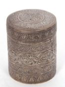 An antique eastern white metal cannister tea caddy decorated with bands of trailing leaves,