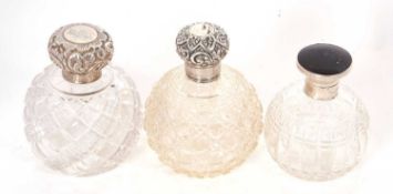 An Edwardian hobnail cut glass scent bottle of globular form, repousee screw on lid and plain