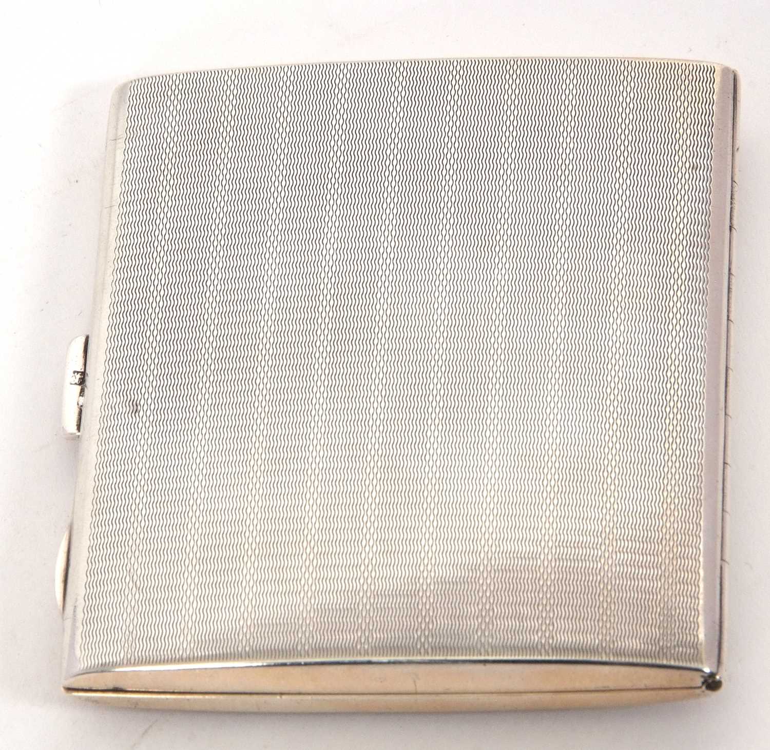 An Art Deco silver cigarette case of rectangular form, engine turned decorated with push button - Image 2 of 2