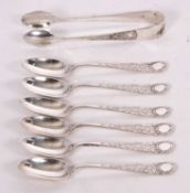 Six Edwardian silver teaspoons, chased and engraved handles around a vacant circular cartouche,