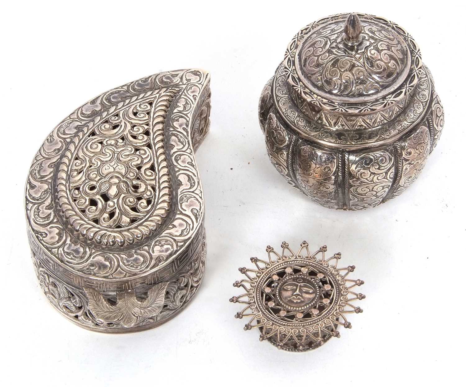 Mixed lot comprising a continental white metal small vase and lid, chased and engraved all over with - Image 2 of 2