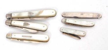 A group of five silver bladed folding fruit knives, mother of pearl handles together with a silver