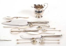 Mixed Lot: A small silver cream jug of plain form, hallmarked for Birmingham 1990, makers mark