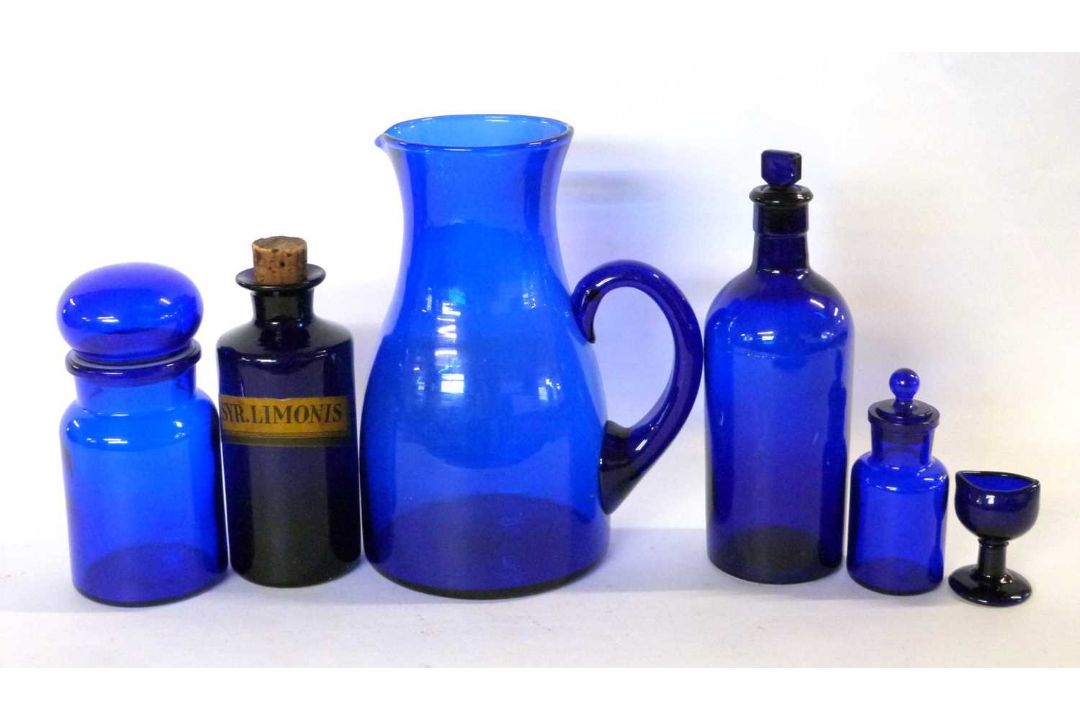 Group of Bristol blue glass wares including a large jug, eye bath and a chemists bottle - Image 1 of 3