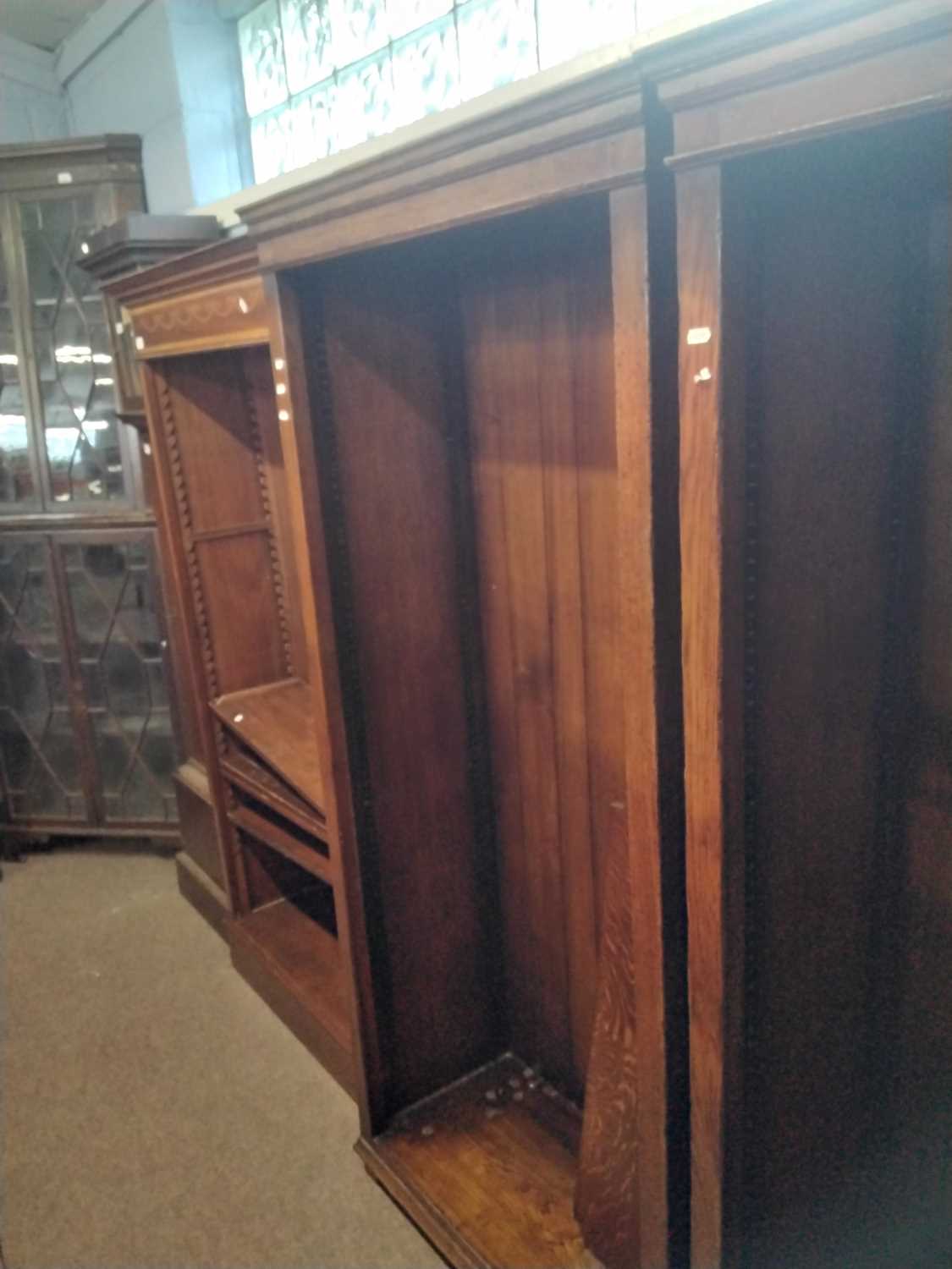 Titchmarsh and Goodwin a pair of large reproduction oak open front bookcase cabinets, raised on