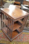 An Edwardian mahogany revolving bookcase cabinet of square form, 86cm high