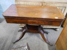 A George IV mahogany and inlaid card table with folding rectangular top opening to a baize lined
