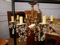20th Century ceiling light fitting with brass cherub decoration, scrolled arms and glass droplets,