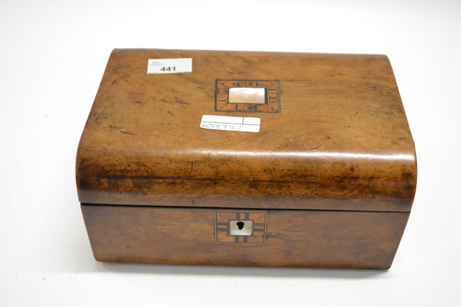 A 19th Century box with mother of pearl inlay to top, 25cm long
