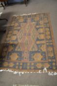 A Middle Eastern shallow pile floor rug with large central panel of lozenges, 180 x 125cm