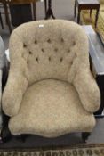 Late Victorian armchair with buttoned feather patterned upholstery and tapering square legs with