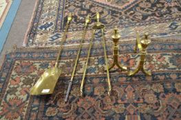 A set of three Victorian brass fire tools together with accompanying pair of stands (5)